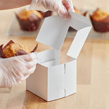 single cupcake box with a beautiful L-shaped window in front, designed to make gifting a breeze. The photograph features the box in its sleek white design, which complements any occasion. The window protects the cupcake while showcasing it, adding a touch of elegance to any gift. Order now for an easy and stress-free gifting experience.